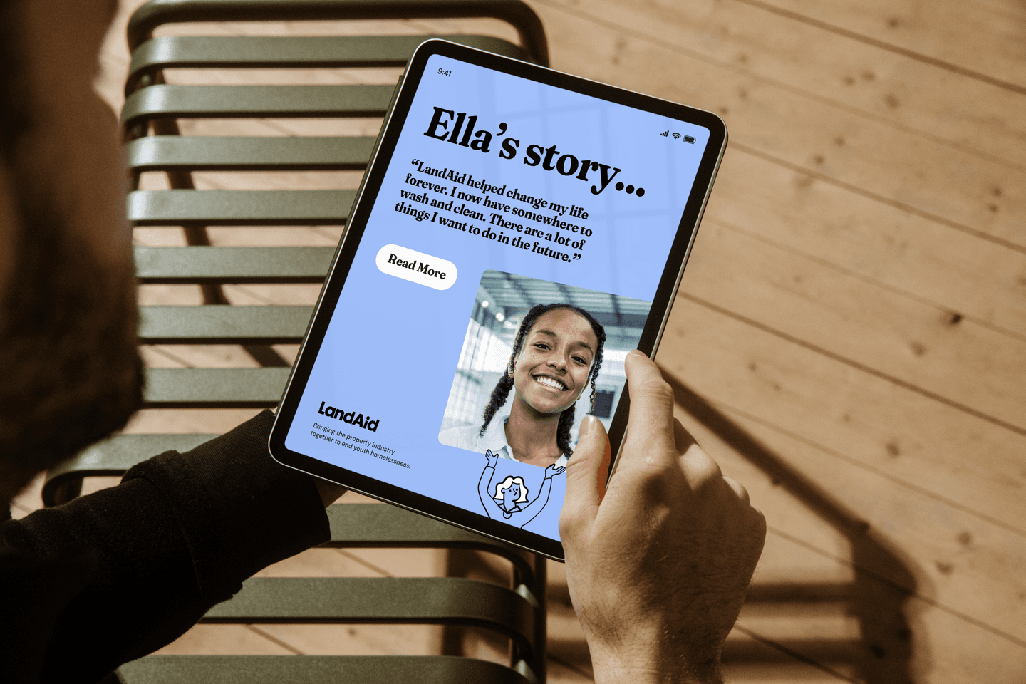 A person holding a tablet.