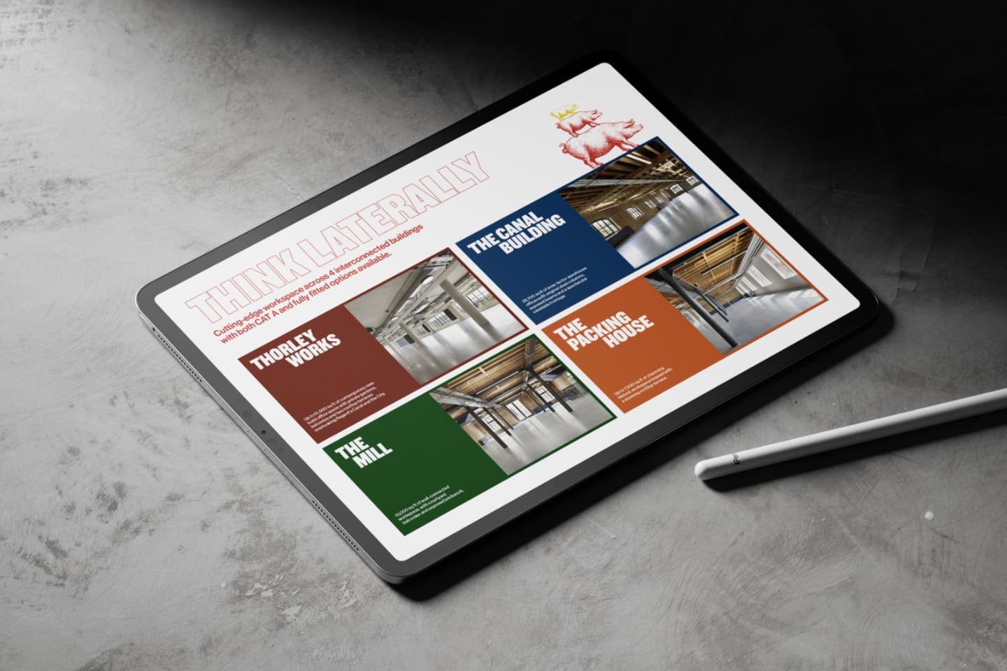 A tablet on a grey surface displays a screen with industrial building photos and labels, titled THINK LATERALLY, next to a stylus.