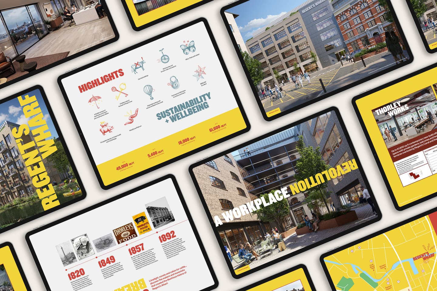 Tablets displaying slides with images, diagrams, maps, and text about Regents Wharf, sustainability, history, and workplace environment, arranged on a white surface.