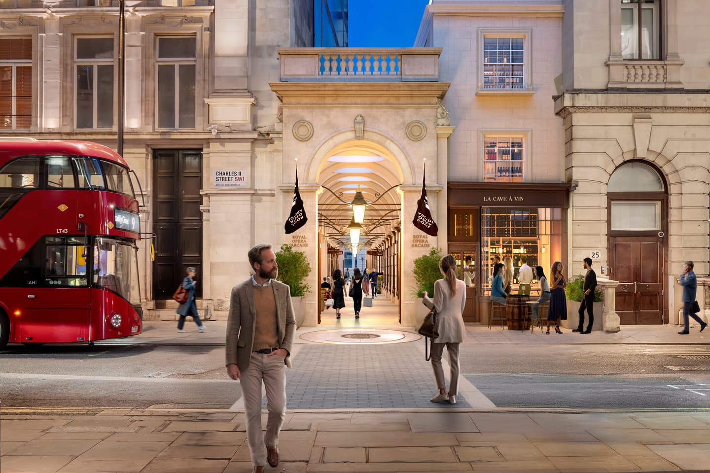 A busy city street at dusk with people walking, a red double-decker bus, and lit shops, including one named La Cava Vin.